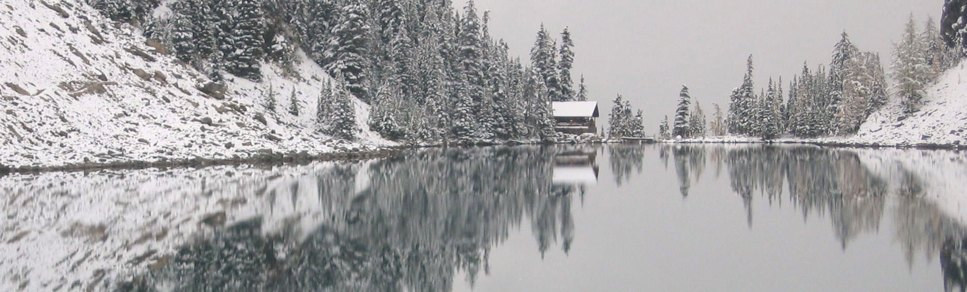 Cottage on lake in winter.
