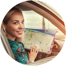 Woman in car with map
